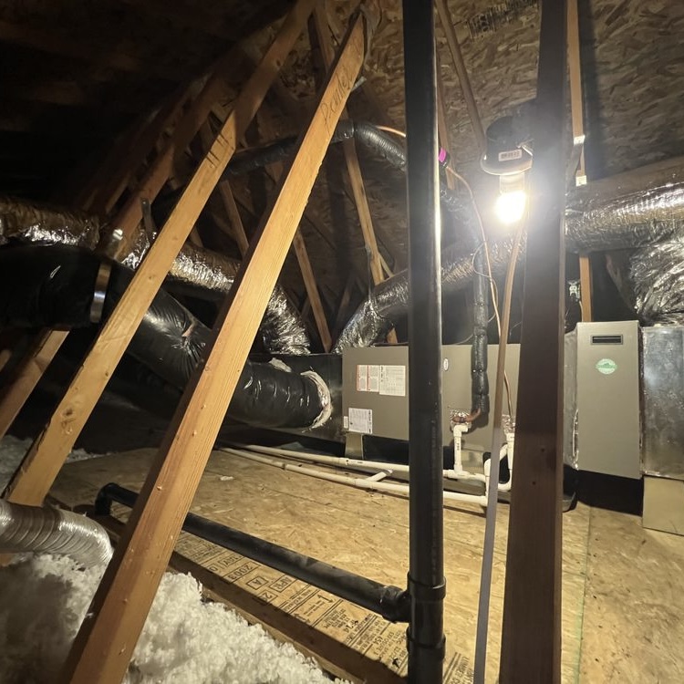 Air handler and ductwork installed in attic during HVAC system replacement