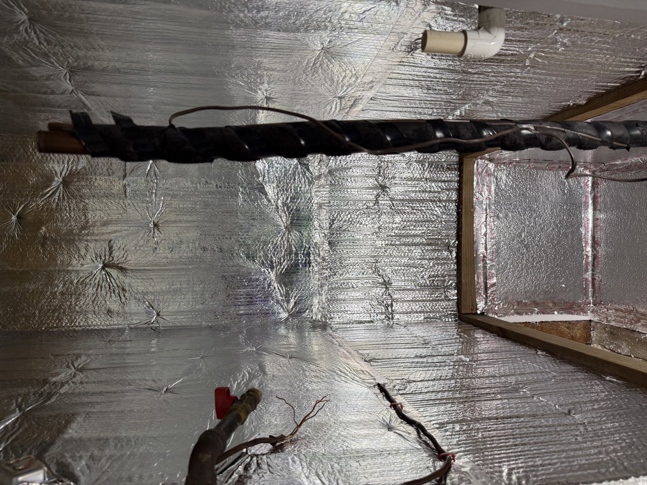 Foil-lined HVAC closet prep work before new system installation in Sacramento