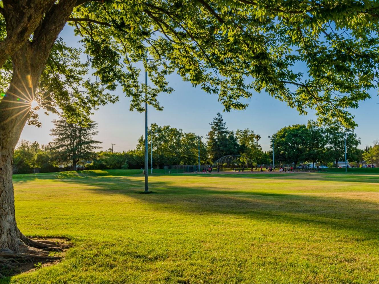 Lincoln Village Community Park at sunset on Routier Road, Sacramento CA 95827, a 16-acre neighborhood park with ball fields and picnic areas