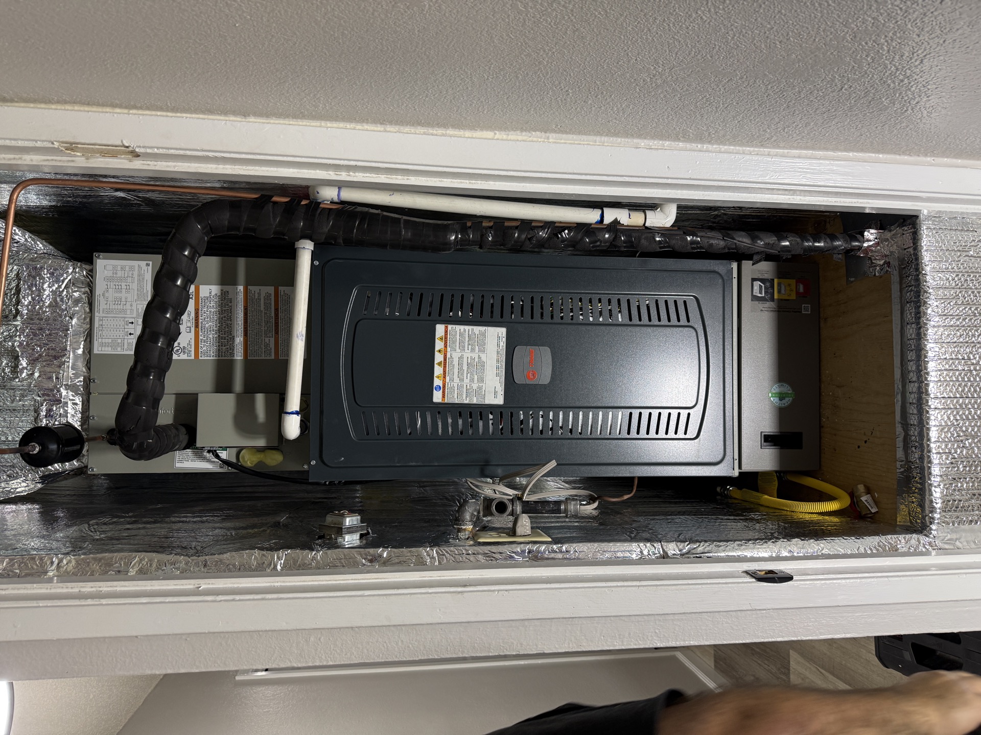 New Rheem furnace installed in ceiling space by Comfortable HVAC Services