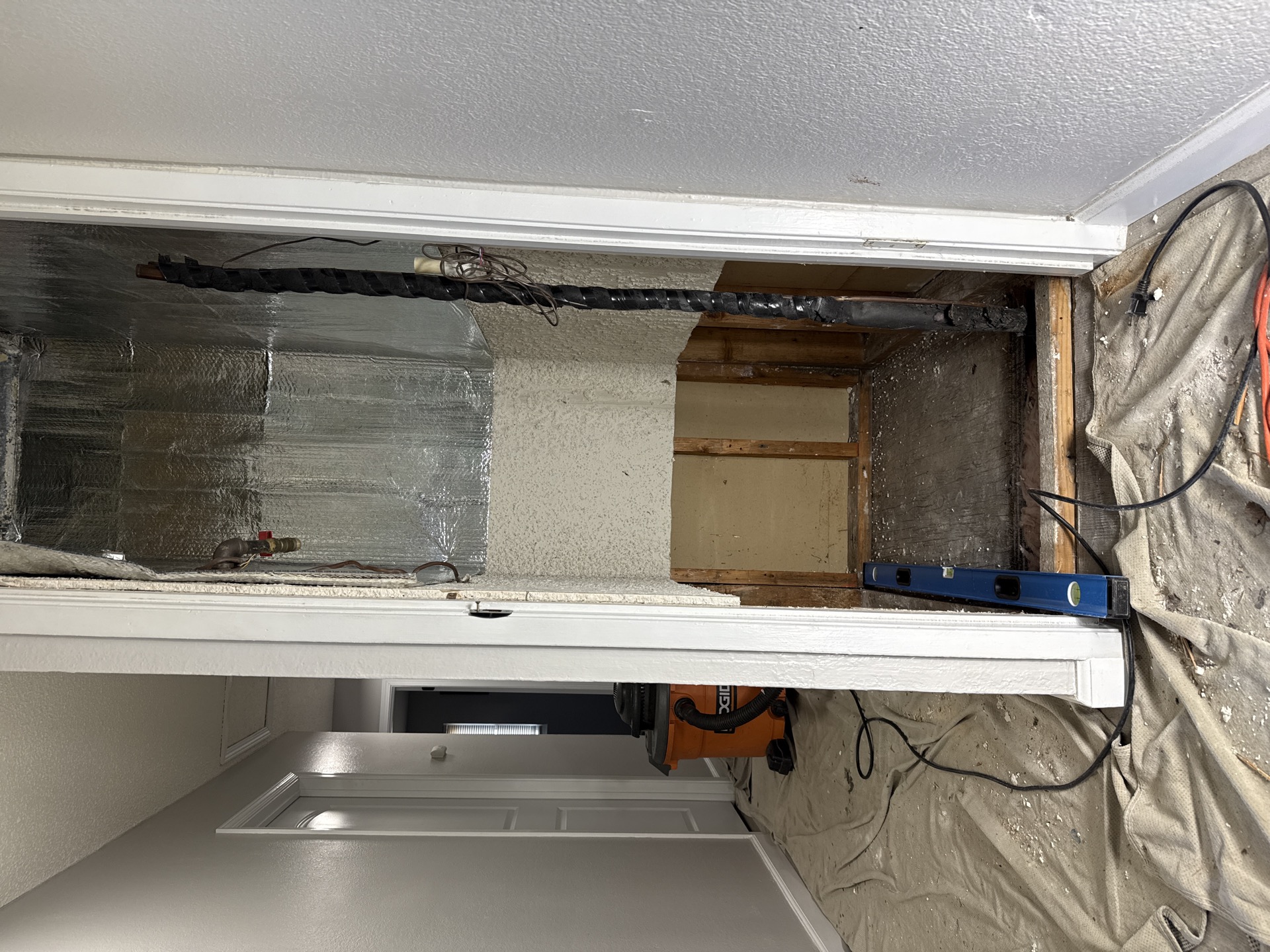 HVAC closet opened and prepped for new air handler installation in Sacramento home